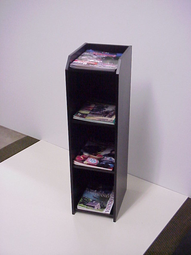 a custom floor standing magazine stand in black