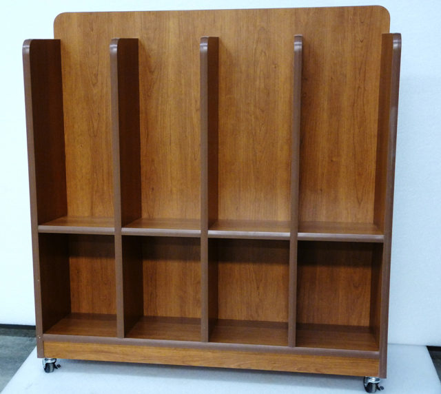 a large capacity custom magazine rack in oak with wheels