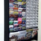 a custom wall mounted brochure rack filled with various brochures and magazines