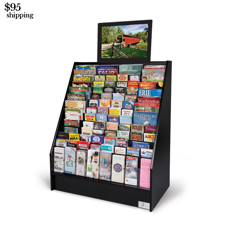 an advanced video display with a monitor above the black display stand full of brochures and magazines