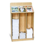 oak floor standing wood magazine bin, partially filled with 3 various magazines